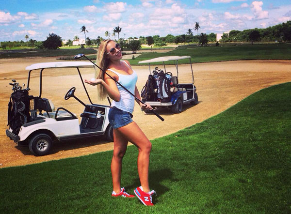 Pretty girl playing golf