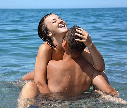 Couple on nude beach vacation